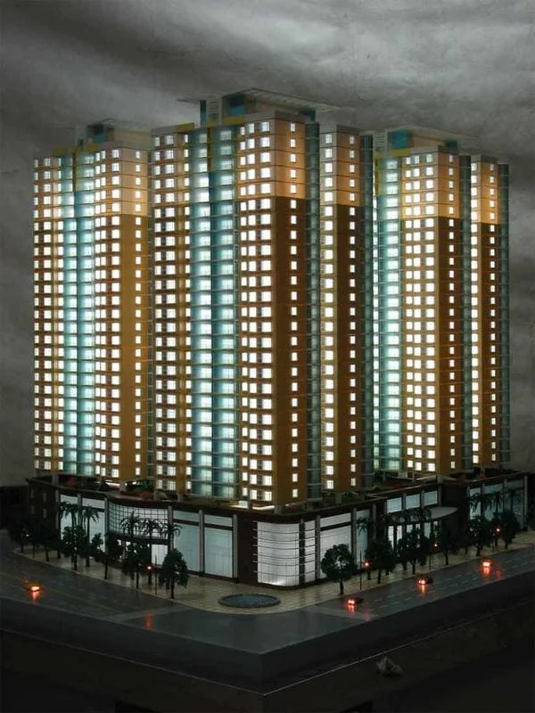 A vertical architectural model showing a tall building